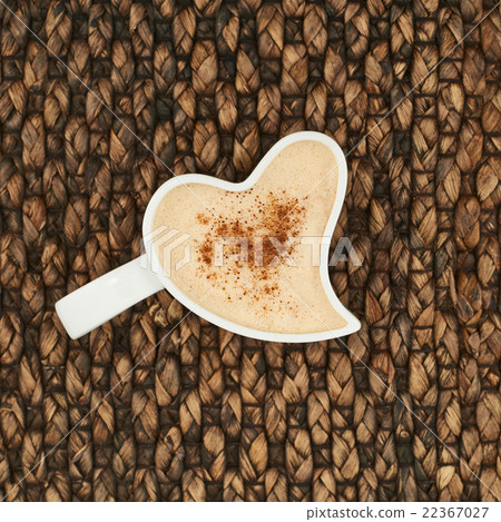 Cup of coffee over a wicker 22367027