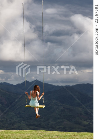 Girl dreaming on a swing  22367591