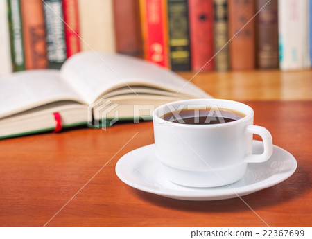 Open book and a cup of coffee 22367699