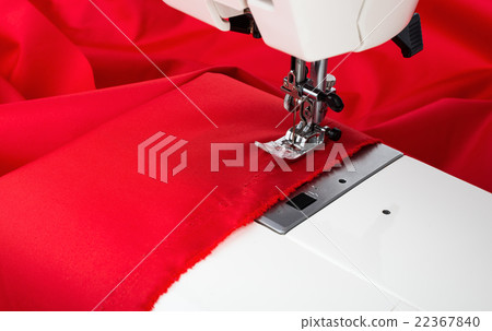 Sewing machine and red fabric isolated on white Sewing machine and red fabric isolated on white 22367840