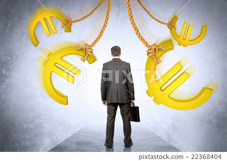 Businessman looking on euro signs Businessman looking on euro signs 22368404