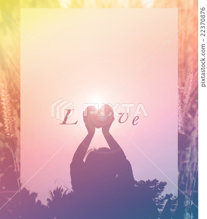 Silhouette back of women raise haert to sky in twilight Silhouette back of women raise haert to sky in twilight 22370876