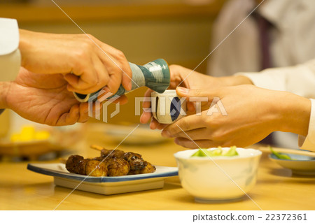 Businessmen popping sake 22372361