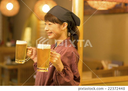 Woman clerk carrying draft beer Woman clerk carrying draft beer 22372448