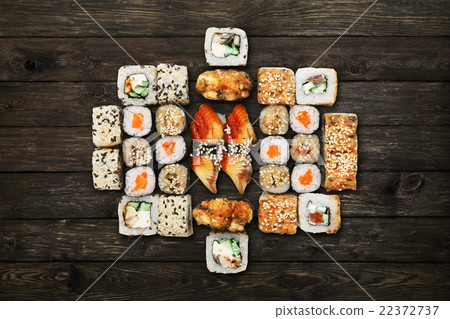 Set of sushi maki and rolls at black rustic wood. 22372737