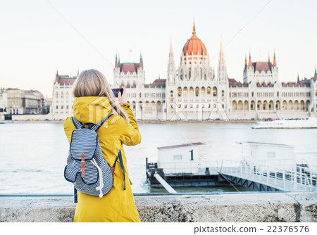 Young blondy woman tourist making photos of 22376576