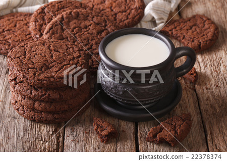 Homemade chocolate cookies and milk close-up Homemade chocolate cookies and milk close-up 22378374