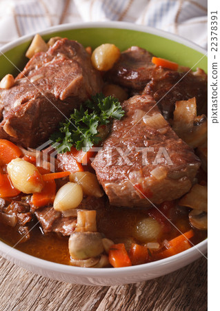 Beef Burgundy close-up in a bowl. vertical 22378391