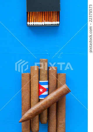 Detail of luxury Cuban cigars on the blue table 22378573