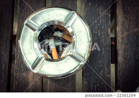 cigarette butt in ashtray, stainless ashtray 22381204