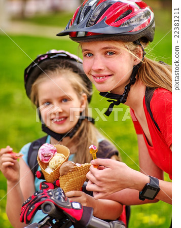 Bikes cycling girls with rucksack cycling eating 22381211