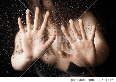Horror woman behind glass, soft focus 22381756