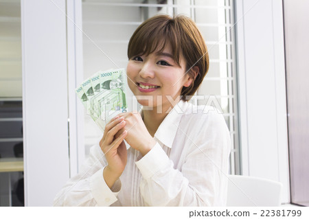 A young woman with a Korean won 22381799