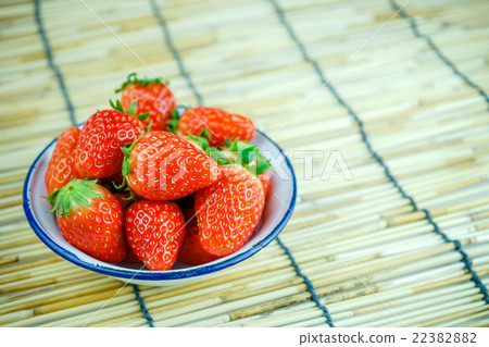 Ripe red strawberries in iron bowl  22382882