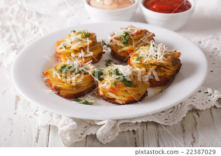Sliced baked potatoes with Parmesan and dill 22387029