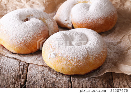 Spanish ensaimadas sweet rolls with powdered sugar Spanish ensaimadas sweet rolls with powdered sugar 22387476