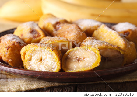 Pisang goreng fried bananas in batter on a plate Pisang goreng fried bananas in batter on a plate 22389119