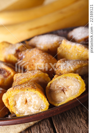 Fried bananas in batter on a plate closeup 22389121