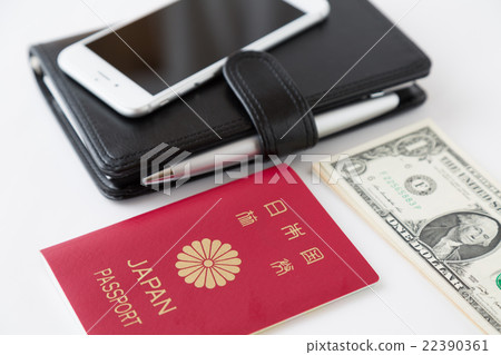 Passport and notebook, smartphone and dollar white back Passport and notebook, smartphone and dollar white back 22390361