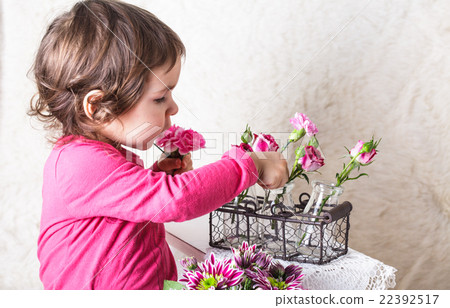 Girl with flowers Girl with flowers 22392517