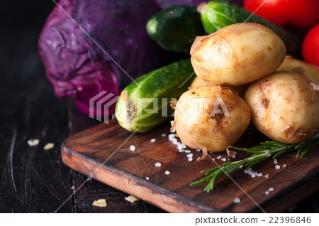 Young potatoes on wooden table Young potatoes on wooden table 22396846