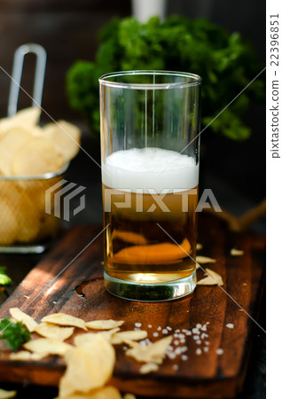 Mug of beer on wooden background 22396851