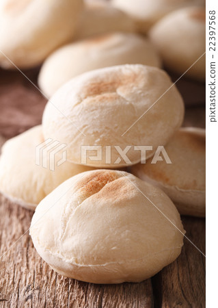 Freshly baked Arabic bread batbout macro. Vertical Freshly baked Arabic bread batbout macro. Vertical 22397568