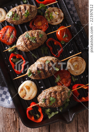 Kofta kebab with grilled vegetables on the grill Kofta kebab with grilled vegetables on the grill 22397612