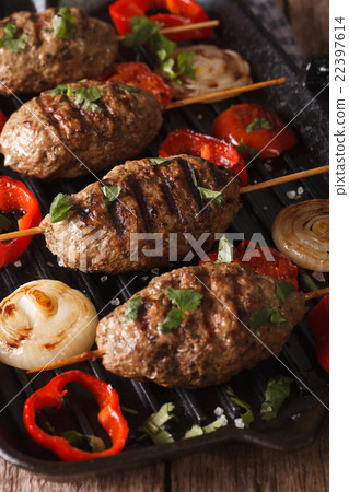 Kyufta kebab with vegetables on a grill pan 22397614