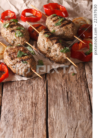 Tasty Kofta kebab with grilled vegetables close-up Tasty Kofta kebab with grilled vegetables close-up 22397630