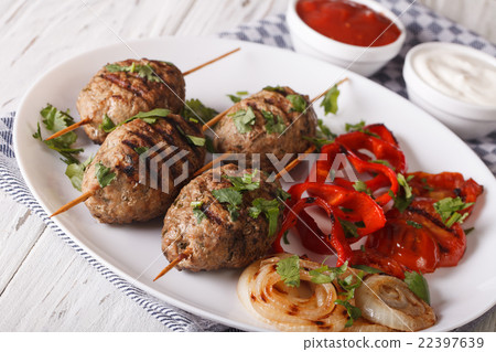 Kofta kebab with grilled vegetables on a plate Kofta kebab with grilled vegetables on a plate 22397639