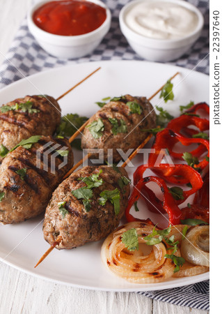 Kofte kebab with grilled vegetables on a plate 22397640