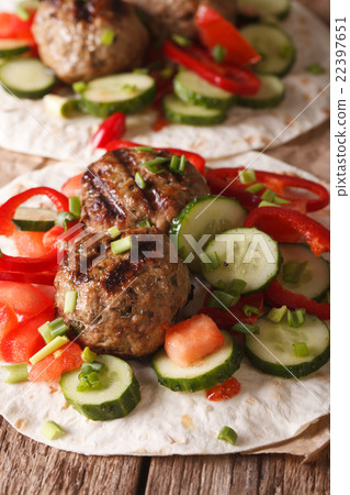 Turkish kofta with fresh vegetables on flat bread 22397651
