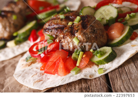 Meatballs with fresh vegetables on a tortilla 22397653