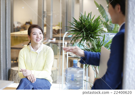 Male and female chatting at the office 22400620