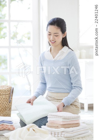 Japanese women folding laundry Japanese women folding laundry 22401246