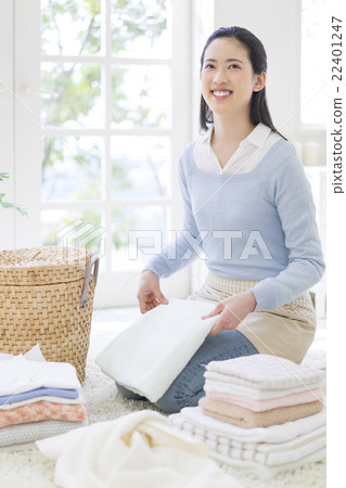 Japanese women folding laundry Japanese women folding laundry 22401247
