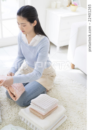 Japanese women folding laundry Japanese women folding laundry 22401265