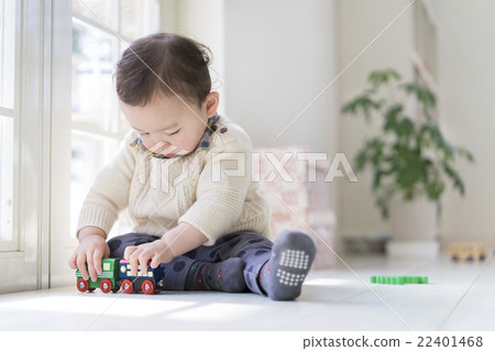 A boy playing with a toy 22401468