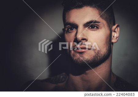 Hispanic man with naked torso posing in studio. Hispanic man with naked torso posing in studio. 22404083