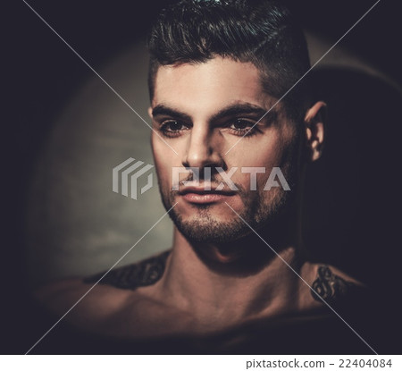 Hispanic man with naked torso posing in studio. Hispanic man with naked torso posing in studio. 22404084