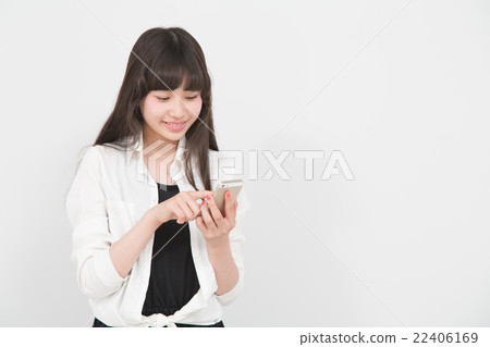 A woman operating a smartphone A woman operating a smartphone 22406169