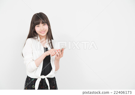 A woman operating a smartphone A woman operating a smartphone 22406173