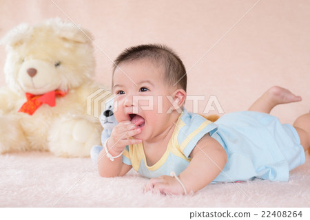 Adorable baby boy in white sunny bedroom. Adorable baby boy in white sunny bedroom. 22408264