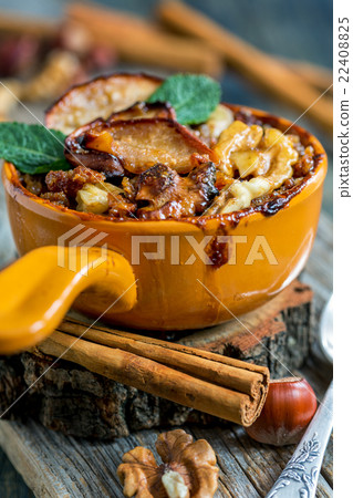 Bowl of porridge with apple, nuts and cinnamon. Bowl of porridge with apple, nuts and cinnamon. 22408825