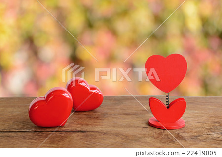 red heart shape and blank note on old wooden red heart shape and blank note on old wooden 22419005