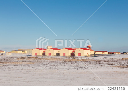 Red hut in winter landscape and clear blue sky 22421330