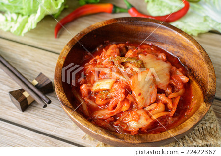 kimchi with Chopsticks on wooden table kimchi with Chopsticks on wooden table 22422367