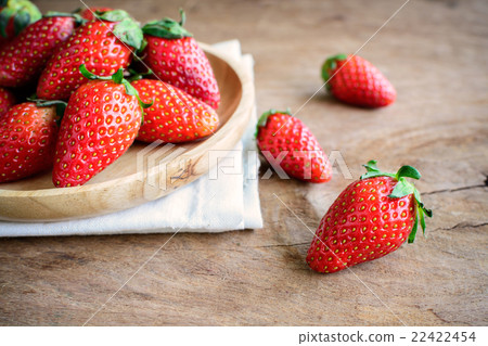 Fresh strawberries on rustic wooden table Fresh strawberries on rustic wooden table 22422454