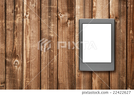 E-book reader on wooden background E-book reader on wooden background 22422627